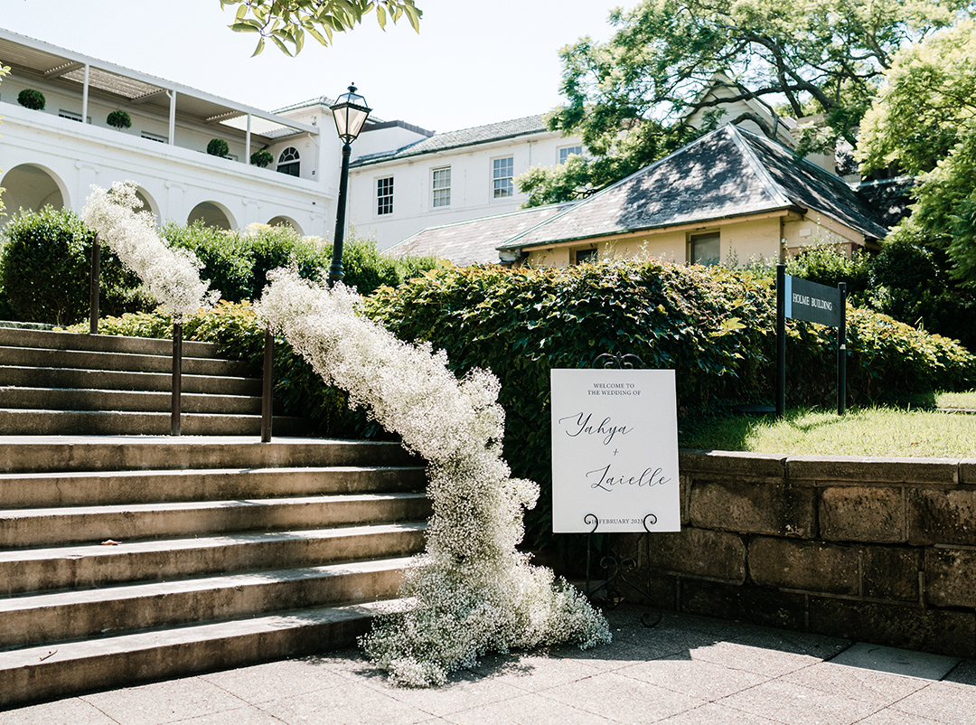 Wedding sign stand in front of the Holme Building