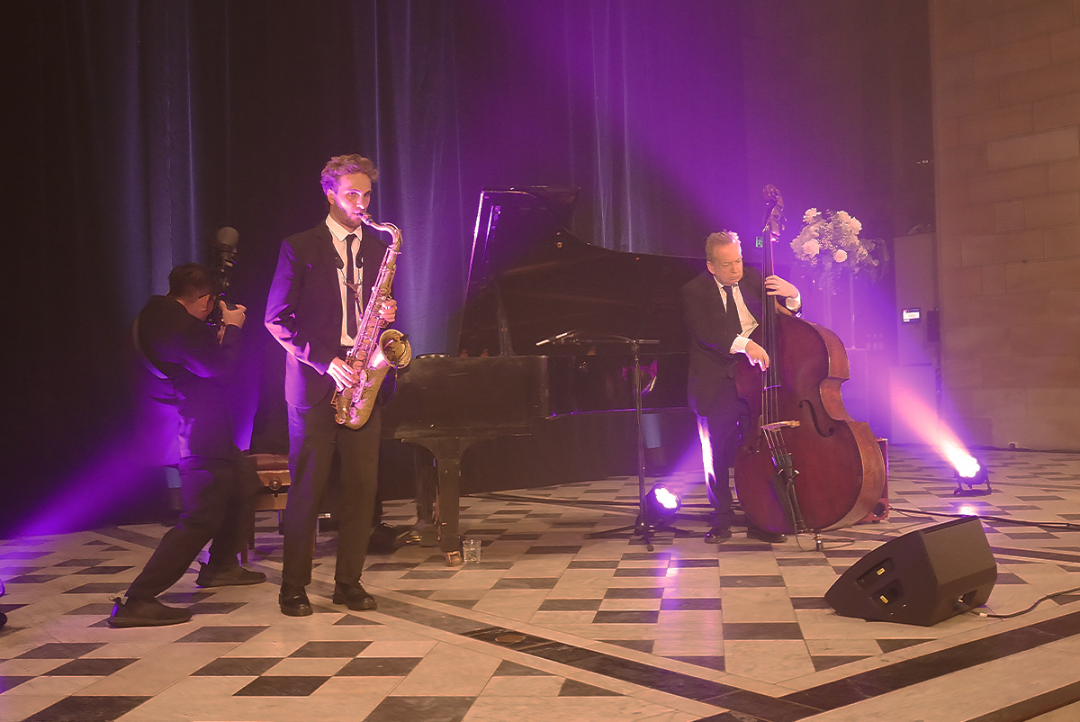 Live music performance on stage at University of Sydney's Great Hall during SIXDO's dinner event 